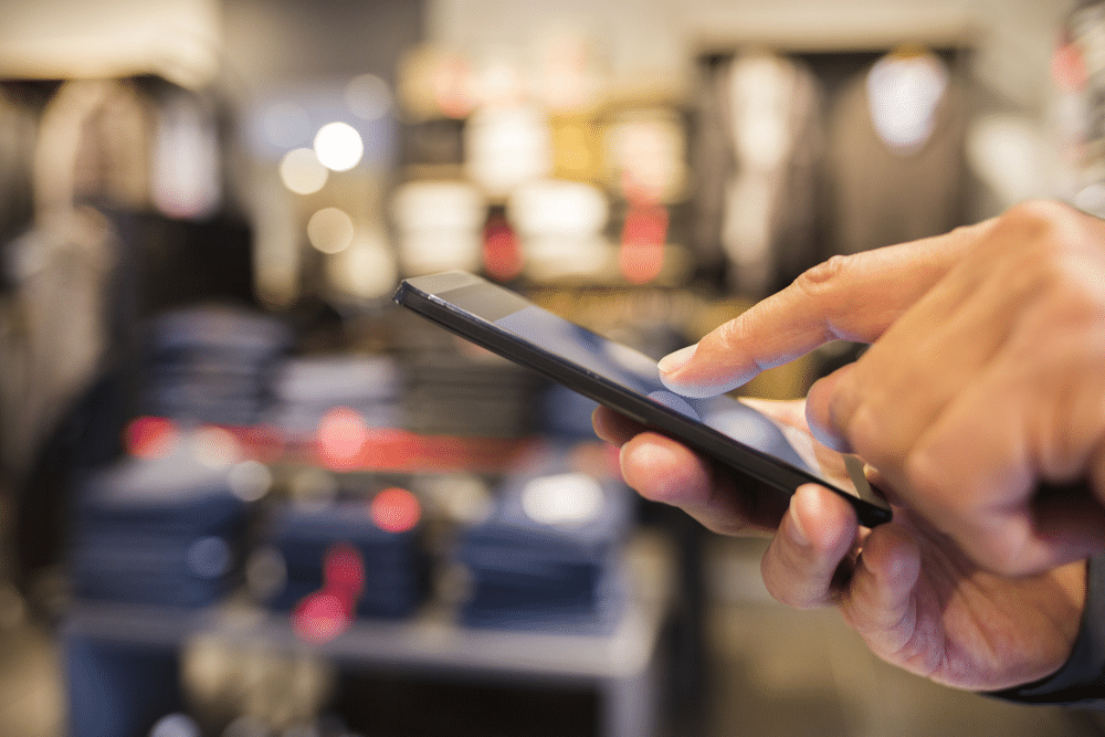 Person on a phone in a store