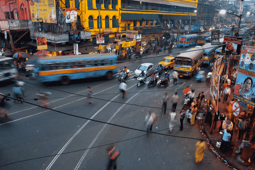 Street traffic blurred in motion at evening in Kolkata, India