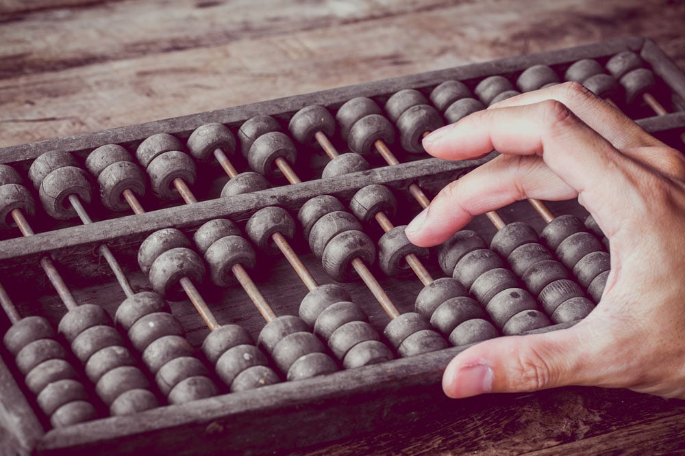 Man using an abacus